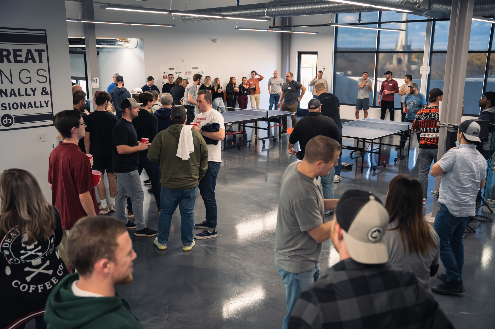 A charity ping pong tournament underway at the Jahnel Group office