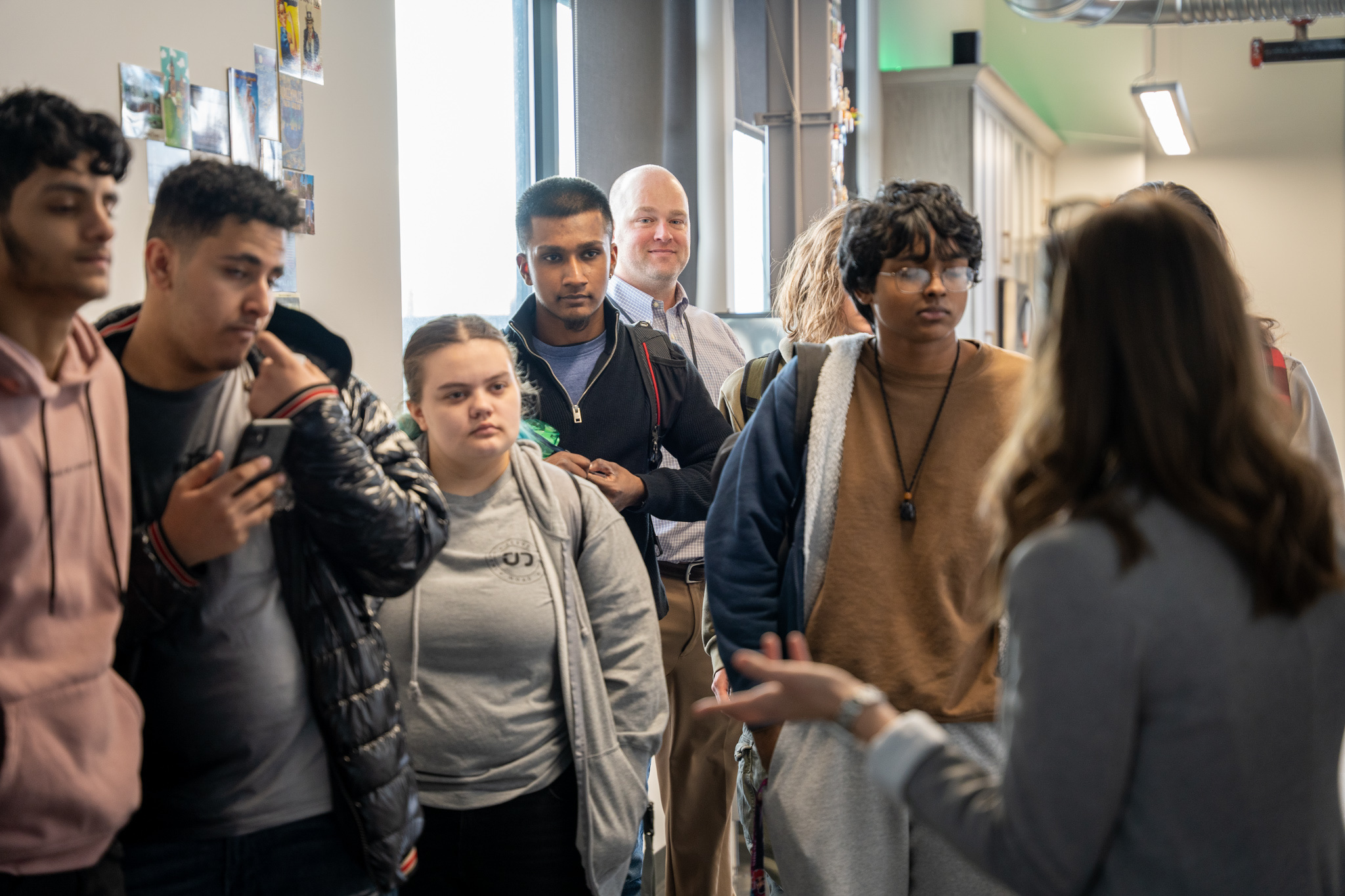 Schenectady High students touring the Jahnel Group office and talking with a team member